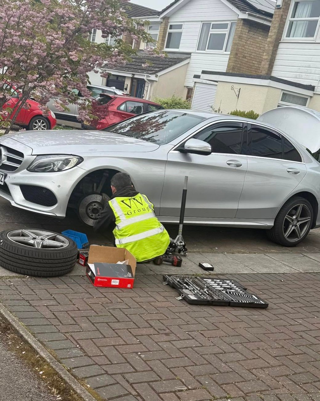 Peter Fix-It carrying out a mobile brake repair on a car on a customer's driveway